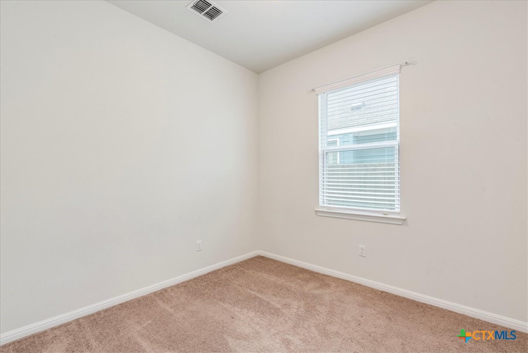360 Spiny Lizard Lane San Marcos, TX 78666 - Photo 15 of 22 an empty room with a window