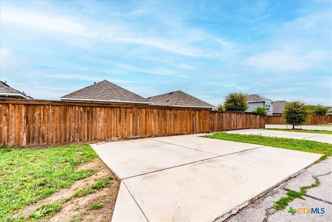 360 Spiny Lizard Lane San Marcos, TX 78666 - Photo 22 of 22 a backyard of a house with lots of green space