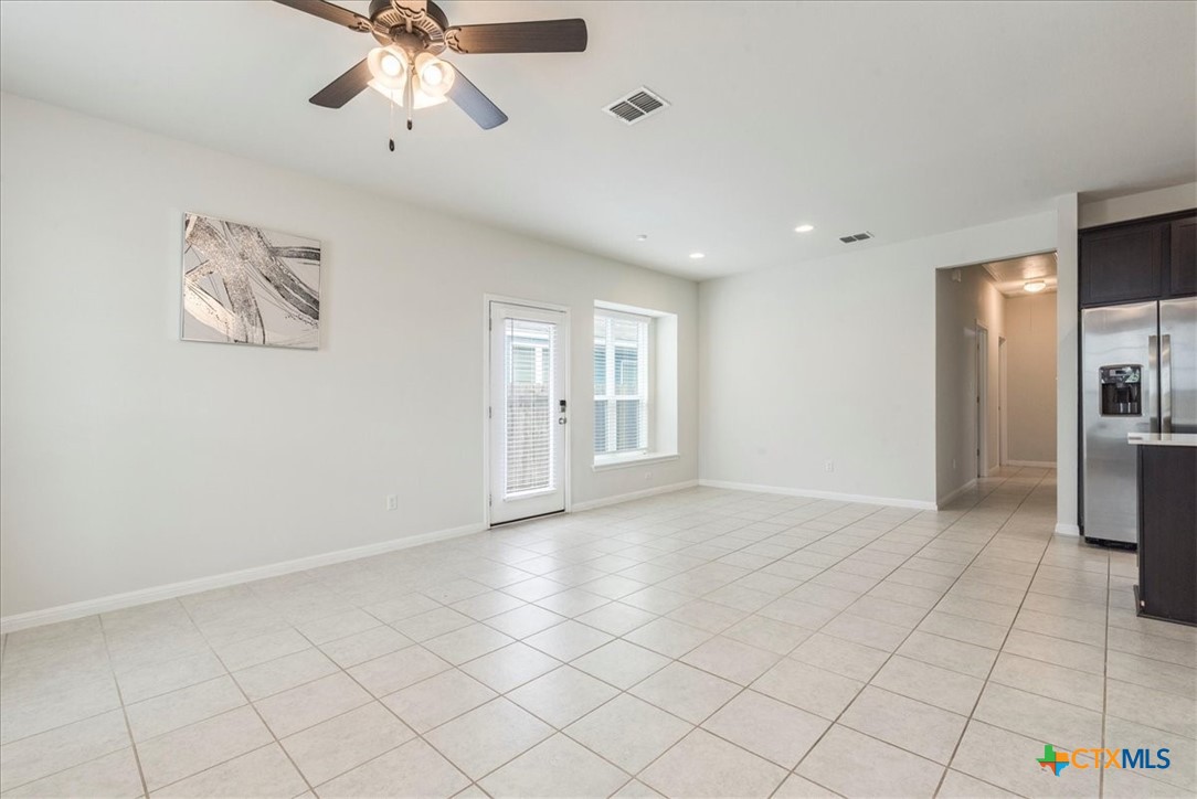 360 Spiny Lizard Lane San Marcos, TX 78666 - Photo 4 of 22 a view of an empty room with a window
