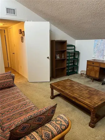 a bedroom with furniture and wooden floor
