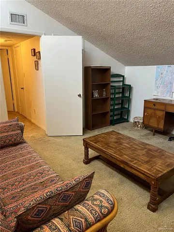 a bedroom with furniture and wooden floor