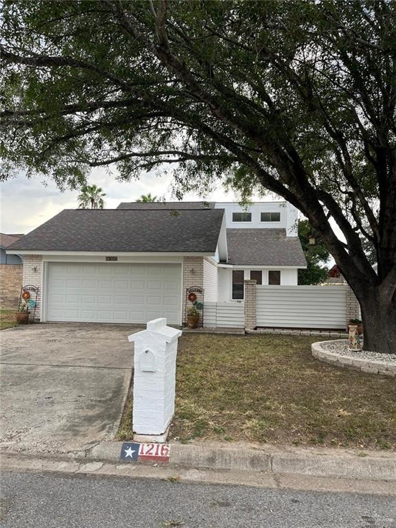 1216 Quail Avenue McAllen, TX 78504 - Photo 2 of 28 front view of a house with a yard