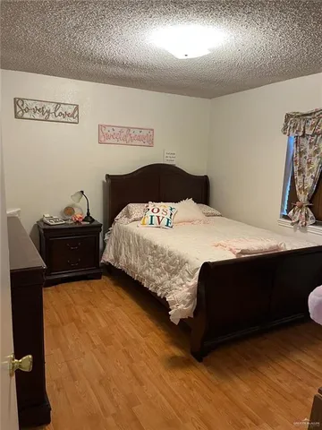 a bedroom with a bed and a table