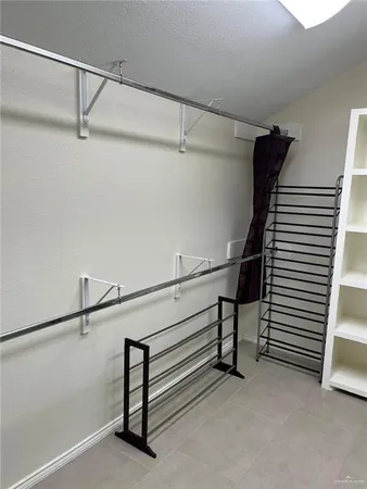 a kitchen with a sink and a stove next to a white cabinet