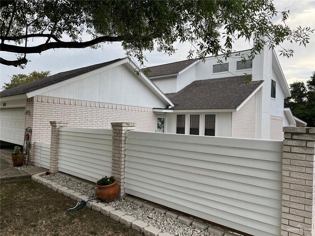 1216 Quail Avenue McAllen, TX 78504 - Photo 27 of 28 a view of a white house with a yard and large tree