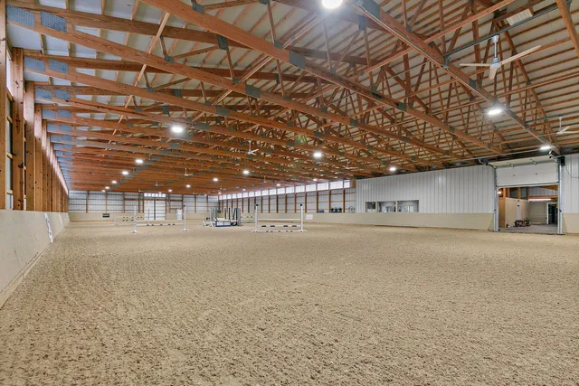 a view of an empty room with kitchen