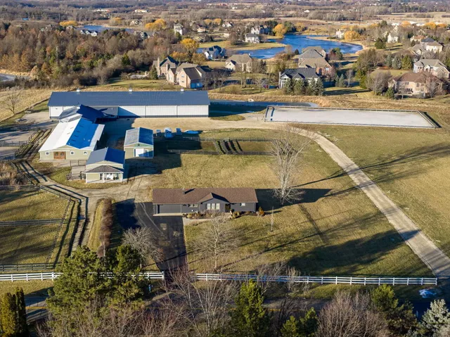 an aerial view of residential houses with outdoor space