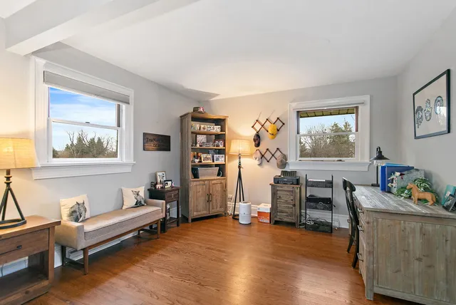 a bathroom with a granite countertop sink toilet and shower a mirror
