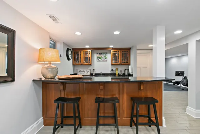 a room with a mirror and a sink