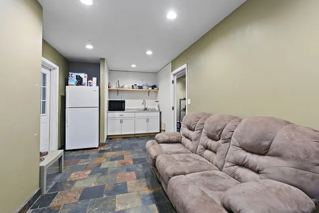 a bathroom with a sink toilet and a mirror