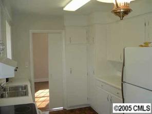 4501 Barwick Road Charlotte, NC 28211 - Photo 5 of 8 a bathroom with a sink and a mirror