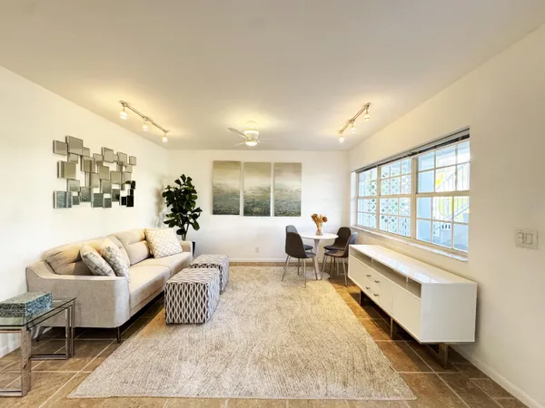a living room with furniture and a large window