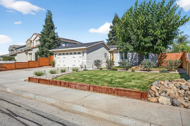 a view of an house with backyard porch and sitting area