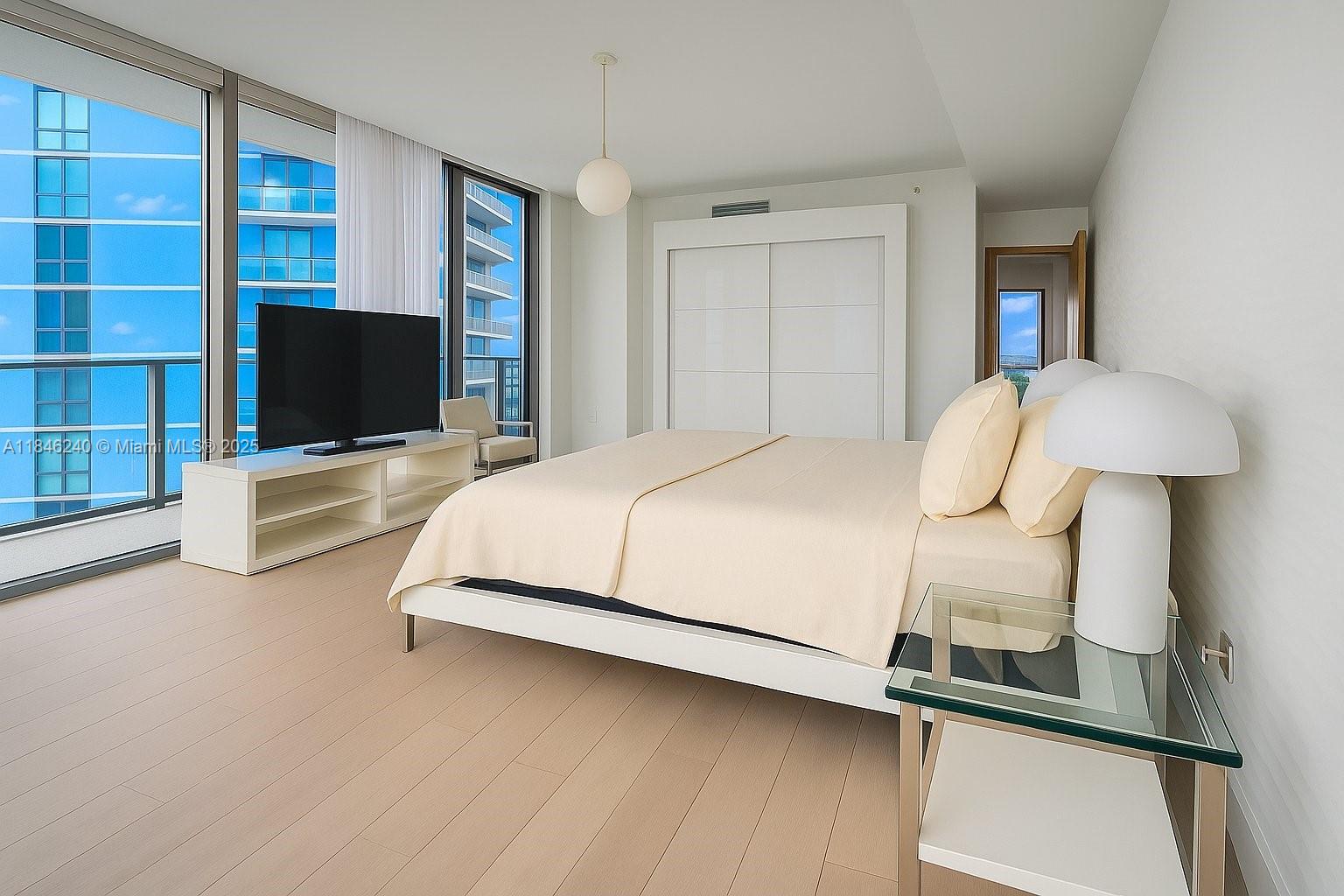 a bedroom with bed and window