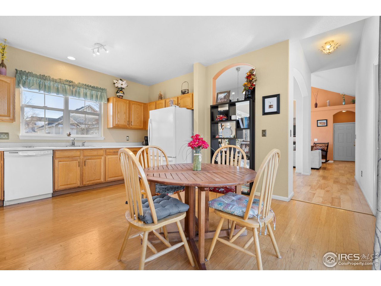 10351 Cook Way Thornton, CO 80229 - Photo 12 of 30 a view of a dining room with furniture and a large window