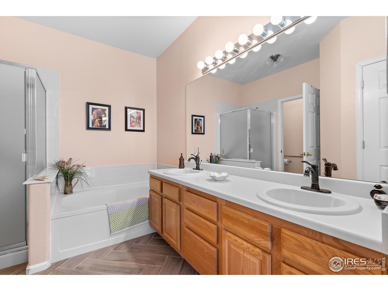 10351 Cook Way Thornton, CO 80229 - Photo 16 of 30 a bathroom with a sink double vanity granite tub and a mirror