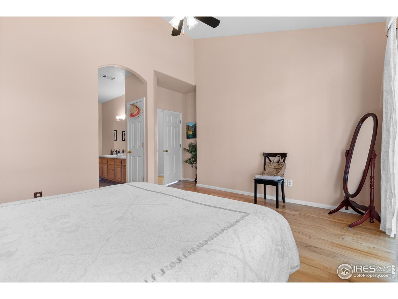 10351 Cook Way Thornton, CO 80229 - Photo 18 of 30 a bedroom with a bed and a chair