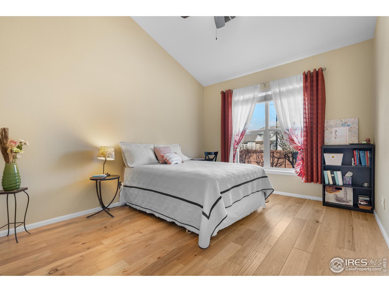 10351 Cook Way Thornton, CO 80229 - Photo 20 of 30 a bedroom with a bed and a table