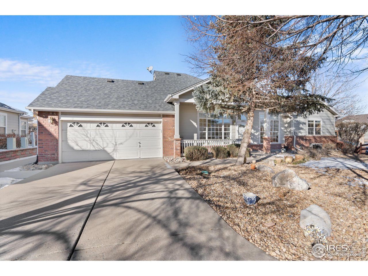 10351 Cook Way Thornton, CO 80229 - Photo 2 of 30 a view of a house with snow on the background