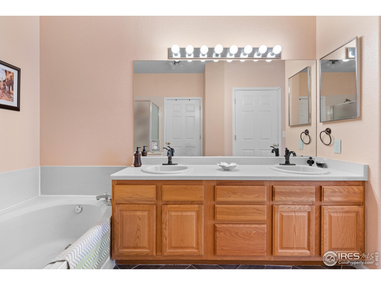 10351 Cook Way Thornton, CO 80229 - Photo 21 of 30 a bathroom with a sink double vanity and a mirror