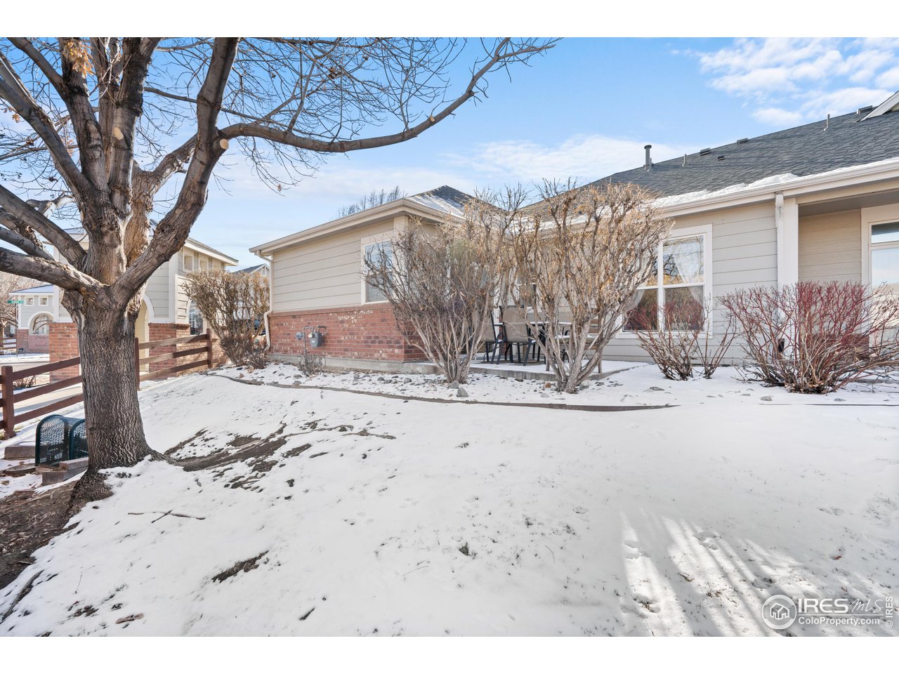 10351 Cook Way Thornton, CO 80229 - Photo 24 of 30 a view of a house with snow on the background