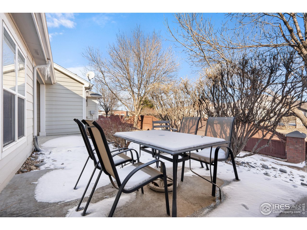 10351 Cook Way Thornton, CO 80229 - Photo 25 of 30 a view of a backyard with a table and chairs