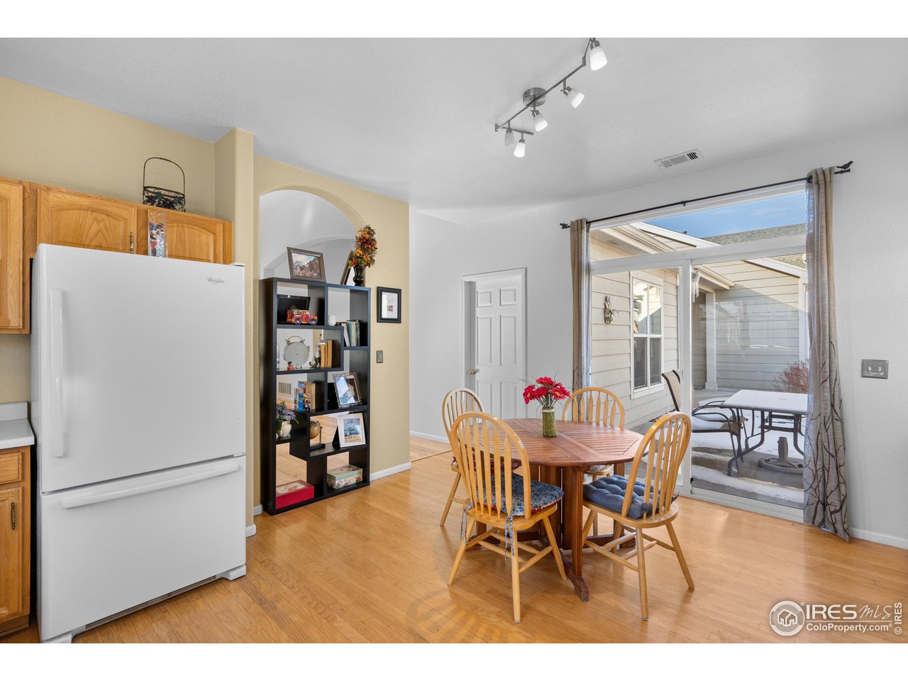 10351 Cook Way Thornton, CO 80229 - Photo 28 of 30 a view of a dining room with furniture and wooden floor