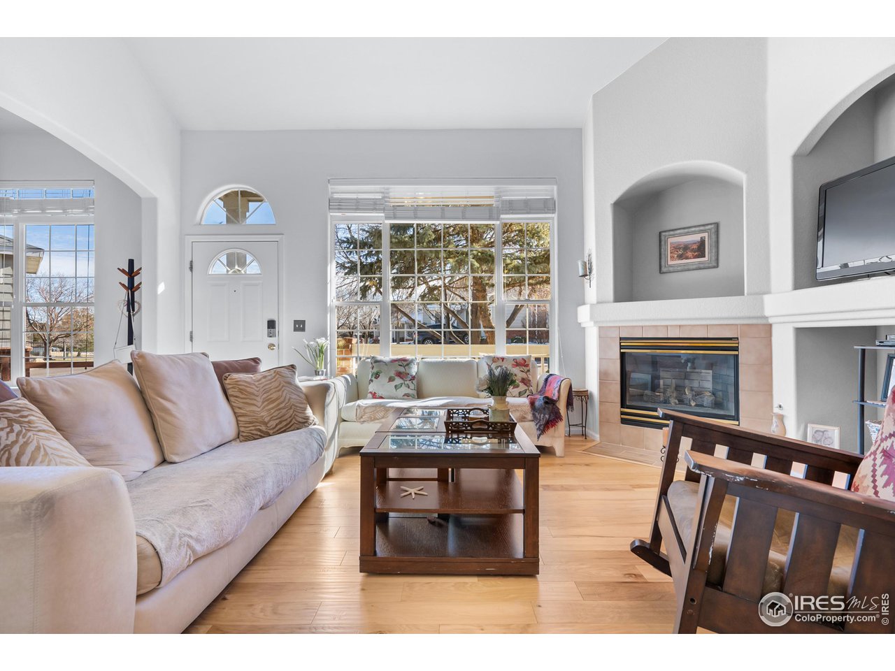 10351 Cook Way Thornton, CO 80229 - Photo 3 of 30 a living room with furniture and a fireplace