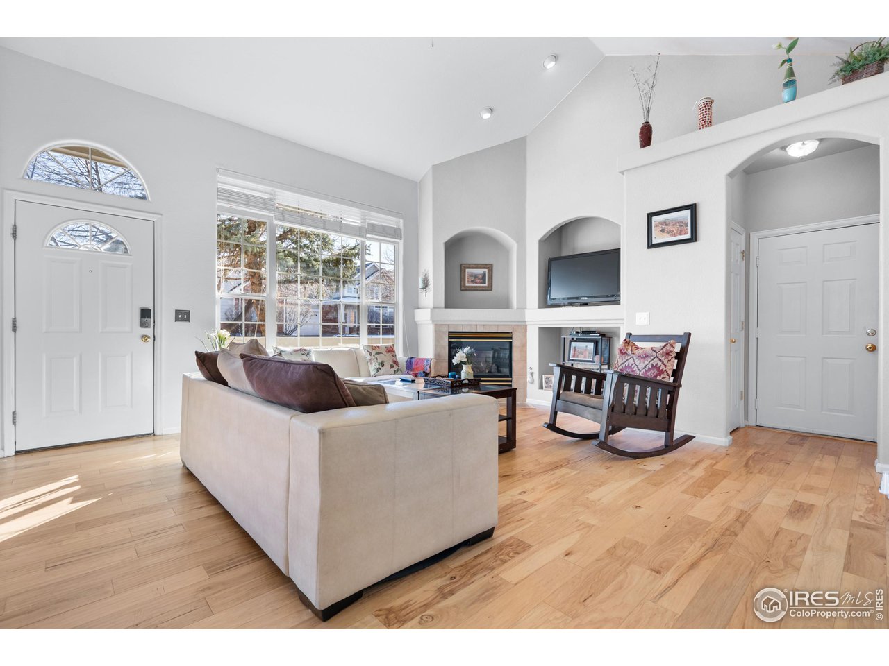 10351 Cook Way Thornton, CO 80229 - Photo 4 of 30 a living room with furniture and a large window