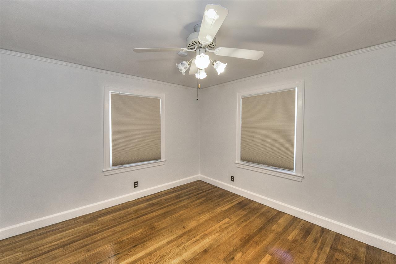 2224 Southampton Road Jacksonville, FL 32207 - Photo 14 of 25 a view of an empty room with wooden floor and a window