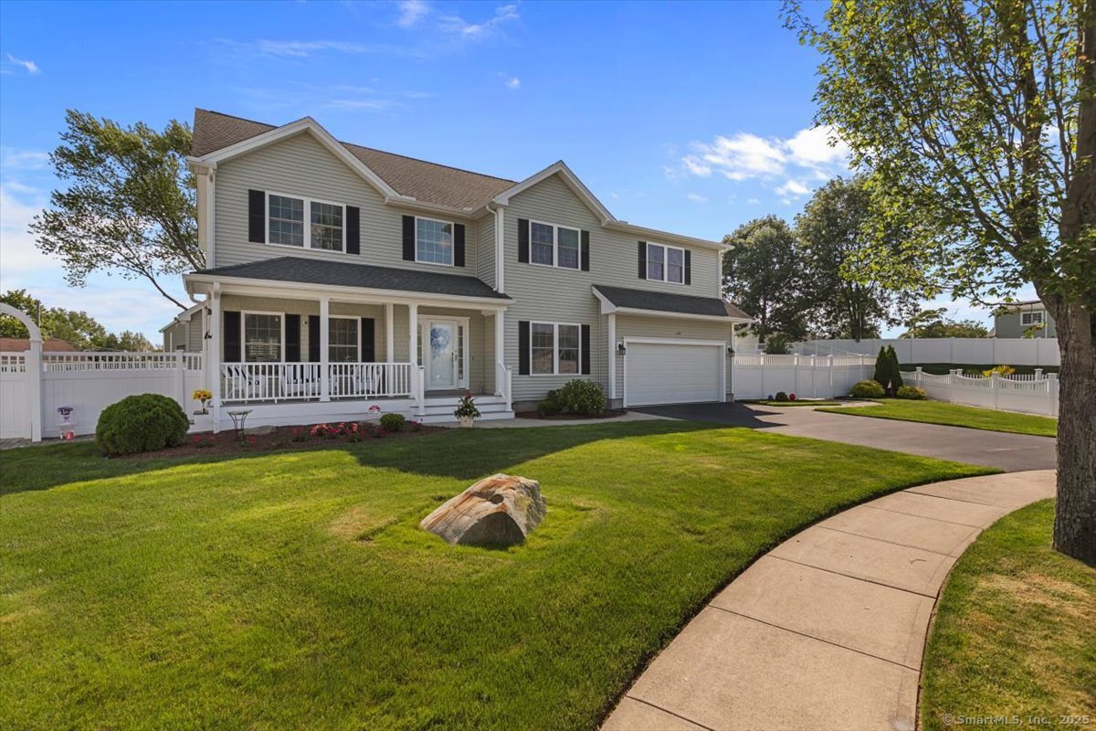40 Devine Place Milford, CT 06460 - Photo 1 of 1 a front view of a house with swimming pool and porch