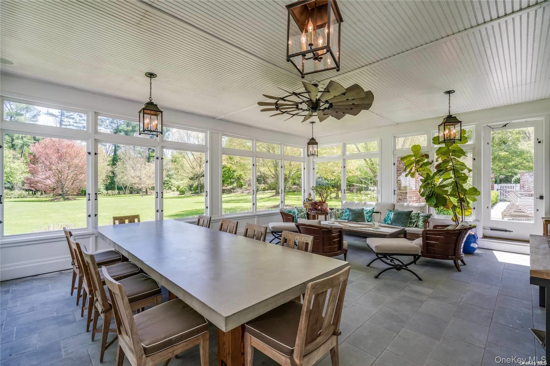 40 Piping Rock Road Locust Valley, NY 11560 - Photo 12 of 33 a view of a dining room with furniture window and outside view