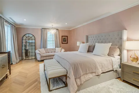 a bedroom with a large bed and a couch