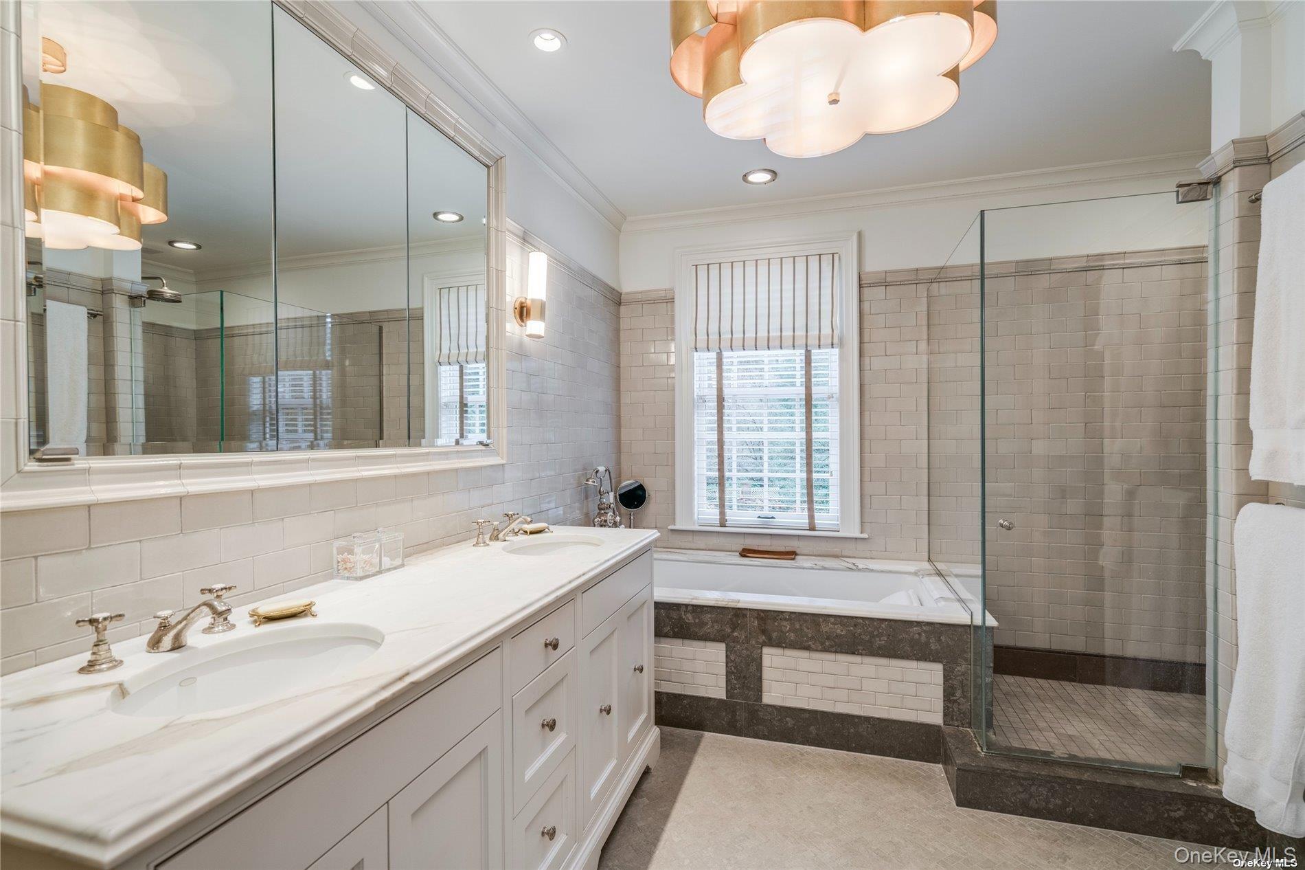 40 Piping Rock Road Locust Valley, NY 11560 - Photo 15 of 33 a bathroom with a double vanity sink mirror and double