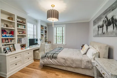 a bedroom with a bed and a book shelf