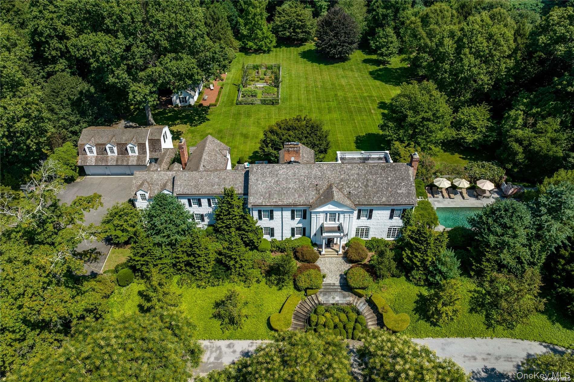 40 Piping Rock Road Locust Valley, NY 11560 - Photo 2 of 33 an aerial view of a house