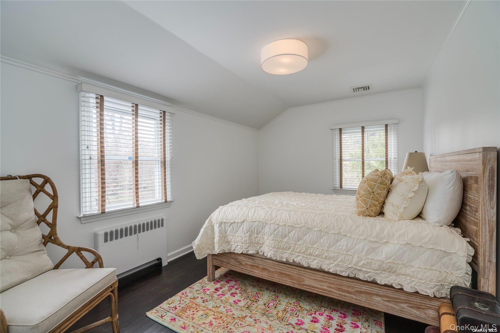 40 Piping Rock Road Locust Valley, NY 11560 - Photo 25 of 33 a bedroom with a bed and a window