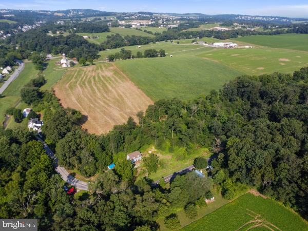 1155 Gebhart Road, Unit LOT B Windsor, PA 17366 - Photo 13 of 25 an aerial view of residential houses with outdoor space and trees