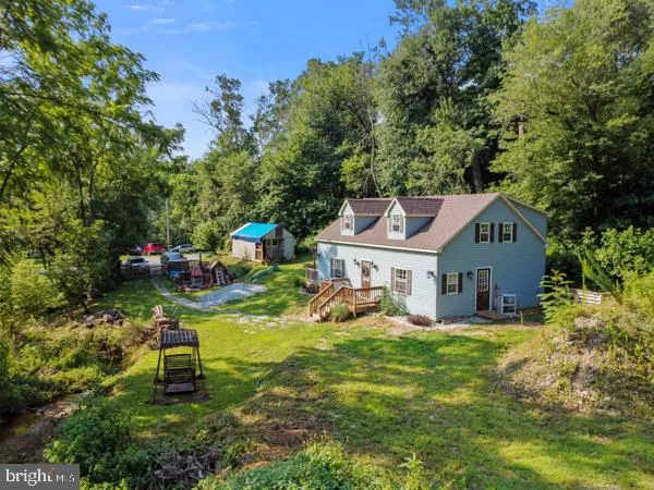 a view of a tree in front of a house
