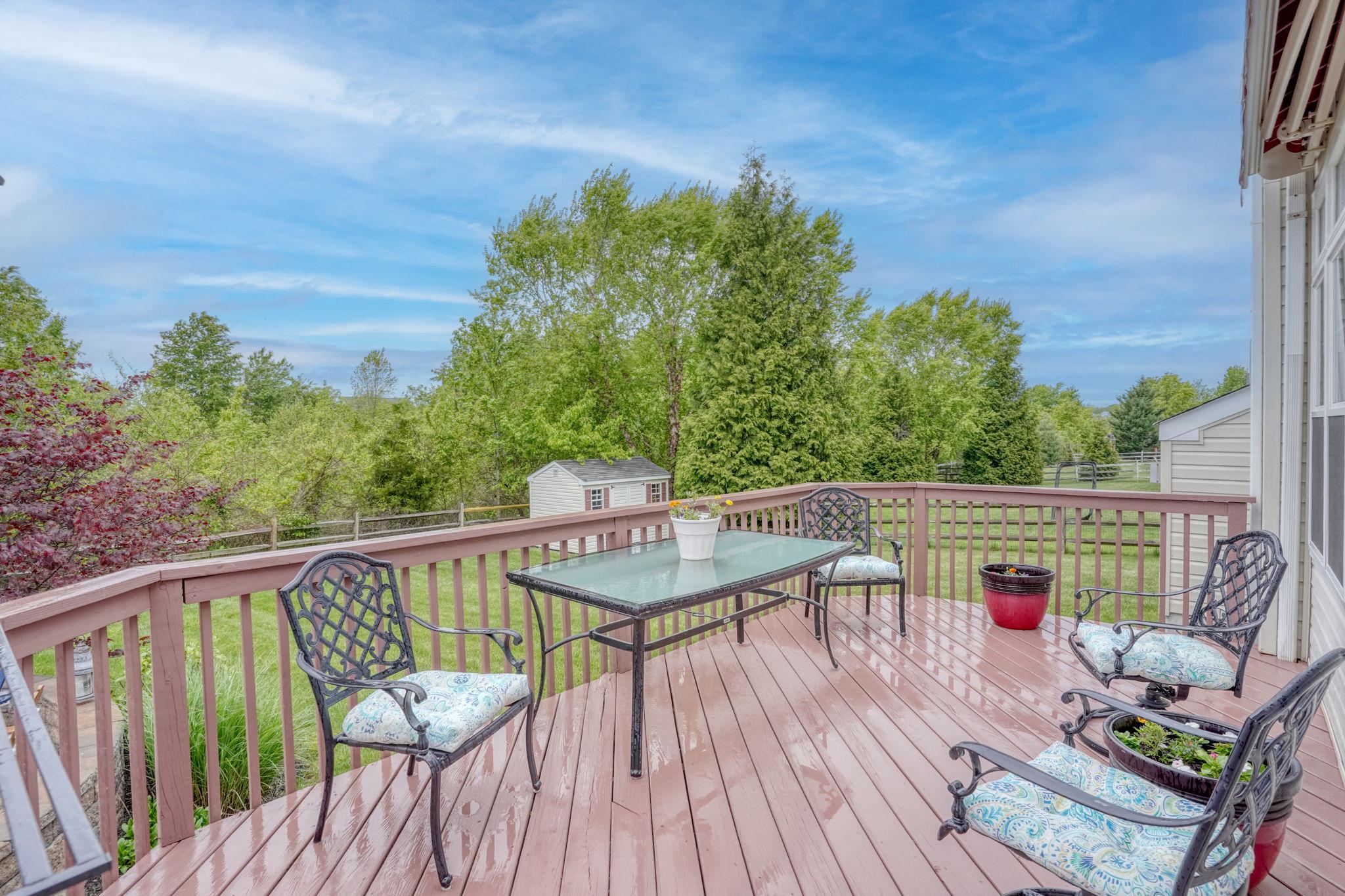213 Loft Street Townsend, DE 19734 - Photo 15 of 76 a view of balcony with furniture and wooden deck
