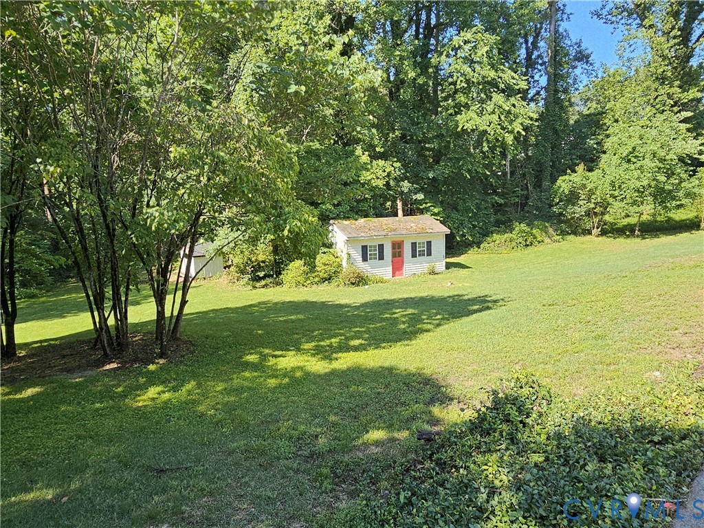 11200 Surry Road Chester, VA 23831 - Photo 43 of 48 a backyard of a house with yard and outdoor seating