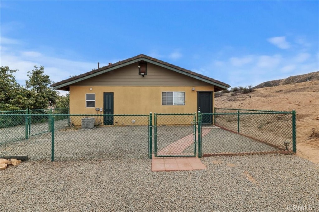 16420 Rocky Glen Road Perris, CA 92570 - Photo 60 of 74 a view of a house with a backyard