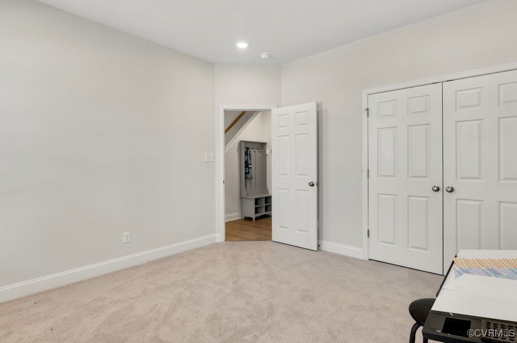 7049 Dunton Road Chesterfield, VA 23832 - Photo 8 of 39 Unfurnished bedroom with light carpet, a closet, a