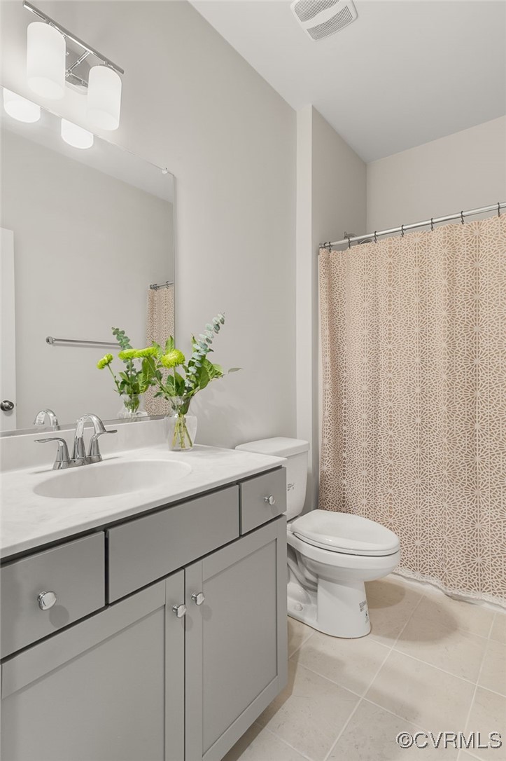7049 Dunton Road Chesterfield, VA 23832 - Photo 10 of 39 Bathroom with tile patterned flooring, visible ven