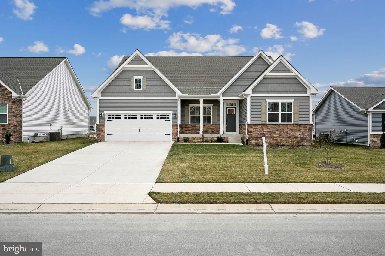 a view of house with yard