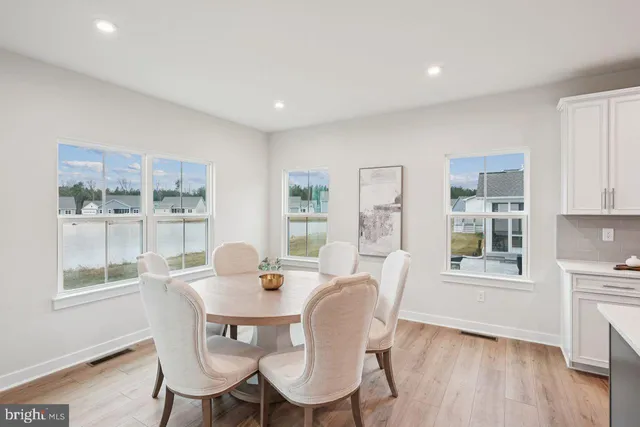 a dining room with furniture window wooden floor
