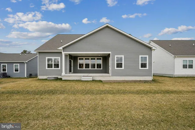 a view of a yard in front of a house with a yard
