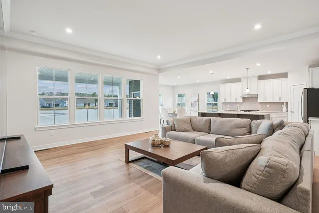 a living room with furniture and windows