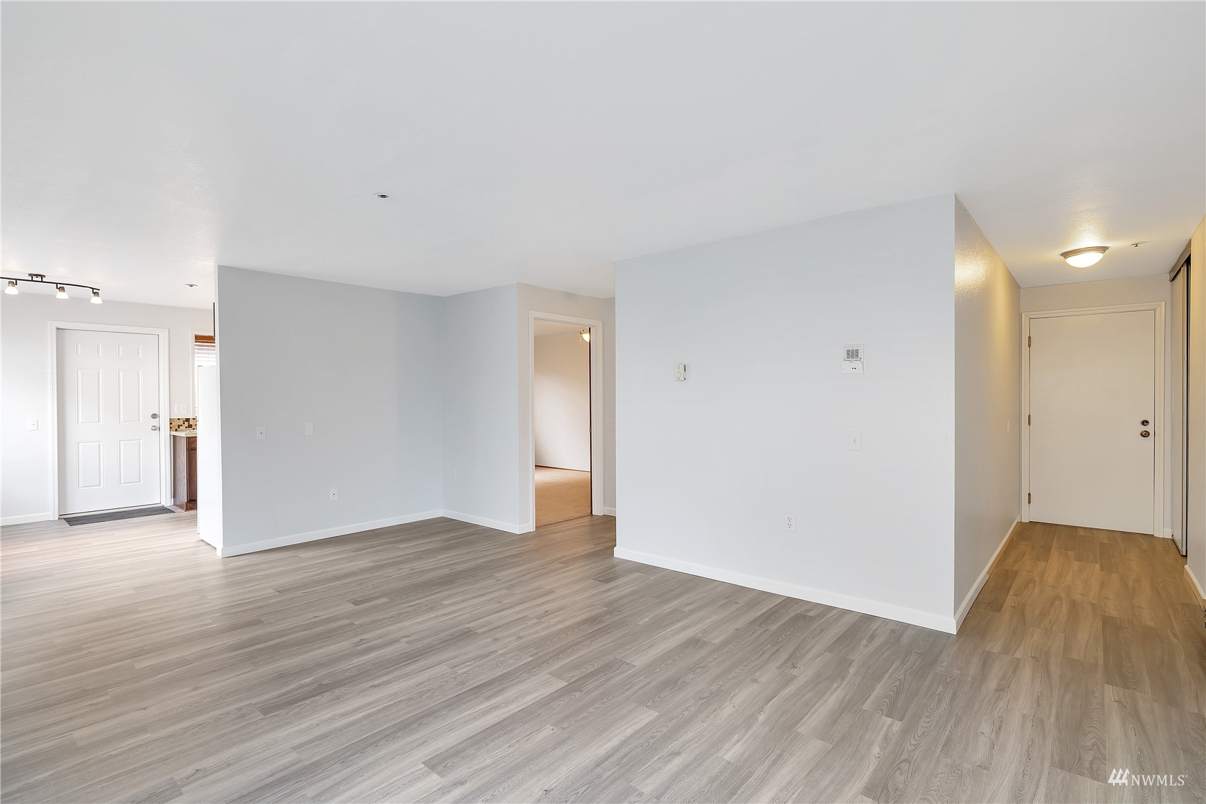 2619 Rucker Avenue, Unit 1 Everett, WA 98201 - Photo 12 of 19 a view of an empty room with wooden floor and a window
