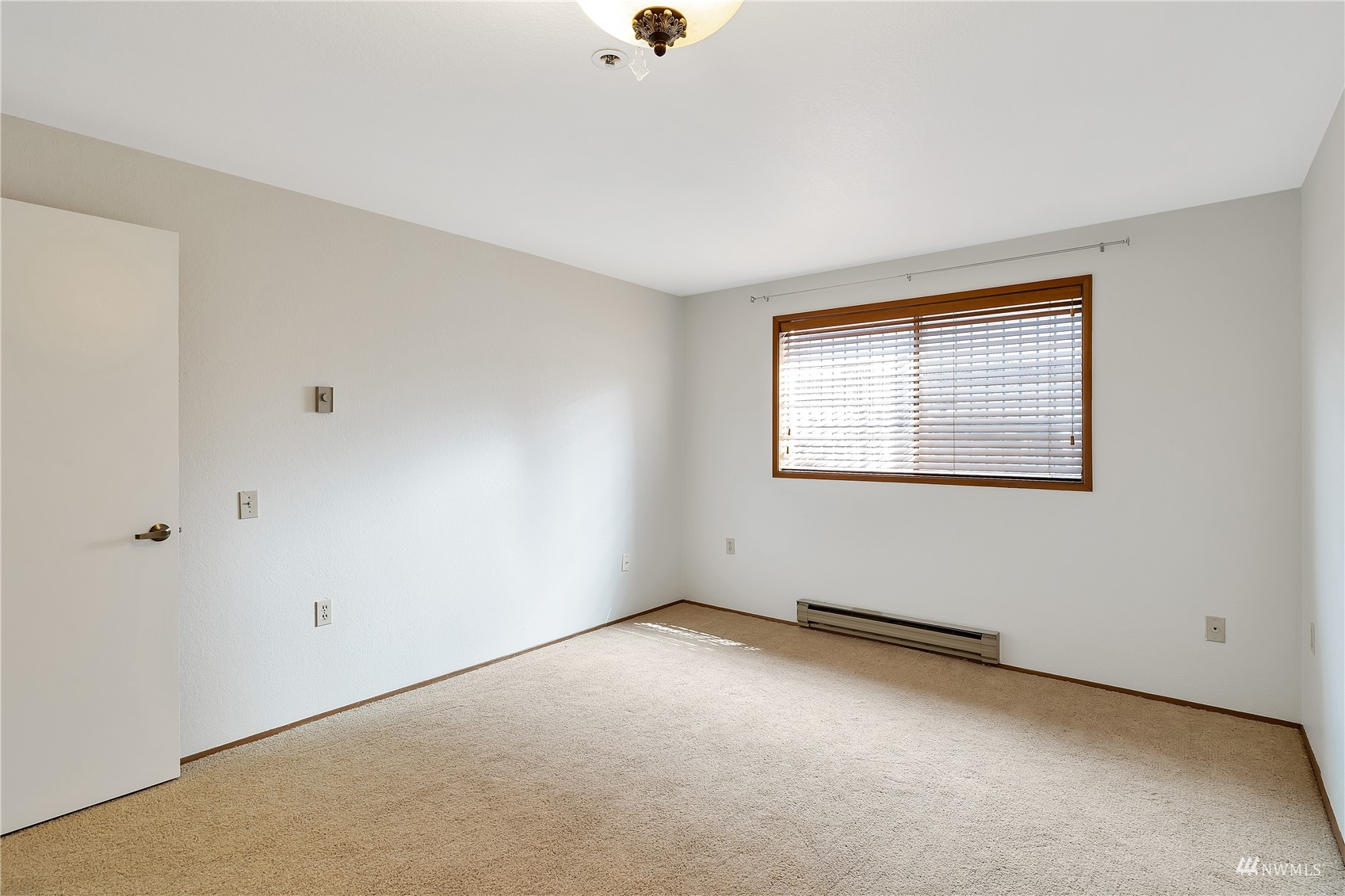 2619 Rucker Avenue, Unit 1 Everett, WA 98201 - Photo 14 of 19 a view of an empty room with a window